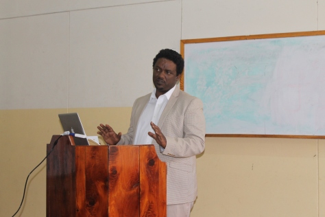Dr. Dawit Wondimagegn, Associate Director of Graduate Medical Education at AAU College of Health Sciences addressing the Monday morning session